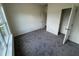 Carpeted bedroom featuring neutral paint, closet, and plenty of natural light at 136 Bruce Dr Dr, Dunn, NC 28334