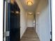 Inviting hallway with wood-look flooring and neutral paint leads to the main living areas at 136 Bruce Dr Dr, Dunn, NC 28334