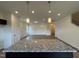 Kitchen island with granite countertop and pendant lights overlooking the open living area at 136 Bruce Dr Dr, Dunn, NC 28334