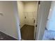Bright laundry area features tile floor, convenient shelving, and utility hookups at 136 Bruce Dr Dr, Dunn, NC 28334
