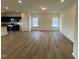 Bright living room featuring wood-look floors, recessed lights, and neutral paint at 136 Bruce Dr Dr, Dunn, NC 28334