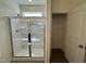 Modern shower room features a glass door and built-in shelving, next to a large closet at 136 Bruce Dr Dr, Dunn, NC 28334