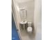 A pristine powder room features a pedestal sink, a mirror and standard toilet at 1413 Chamblee Rd, Zebulon, NC 27597