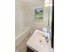 Bright bathroom with a shower/tub combo, window, and clean white vanity at 1413 Chamblee Rd, Zebulon, NC 27597