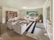 Bright living room with modern furniture, large window, and stylish decor accents at 1413 Chamblee Rd, Zebulon, NC 27597