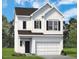 Charming two-story home featuring a classic white exterior and a spacious two-car garage at 144 Bruce Dr, Dunn, NC 28334
