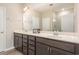 Bathroom featuring double sinks, and a large mirror at 157 Willow Grove Ln, Fuquay Varina, NC 27526