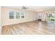 Bright and airy living room with wood-look floors and plenty of natural light at 157 Willow Grove Ln, Fuquay Varina, NC 27526