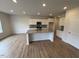 Modern kitchen featuring granite countertops, stainless steel appliances, and a spacious island at 16 Freedom Heights Ln, Smithfield, NC 27577