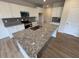 Modern kitchen boasts granite countertops and stainless steel appliances at 16 Freedom Heights Ln, Smithfield, NC 27577