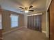 Bedroom with a window, closet, and carpeted floor at 1704 Southgate St, Durham, NC 27703