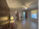 Bedroom with wood laminate flooring, ceiling fan, and windows providing natural light at 1704 Southgate St, Durham, NC 27703