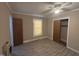 This bedroom has vinyl flooring and has one window for natural light at 1704 Southgate St, Durham, NC 27703