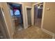 Hallway connecting to bathroom and another room, featuring tile flooring at 1704 Southgate St, Durham, NC 27703