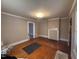 Open living room with hardwood floors, decorative fireplace, and natural light at 1704 Southgate St, Durham, NC 27703