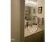 Clean bathroom with a vanity, sink, and framed mirror at 1708 Quail Ridge Rd, Raleigh, NC 27609