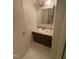 Bathroom featuring a vintage vanity with a neutral countertop and tile flooring at 1708 Quail Ridge Rd, Raleigh, NC 27609