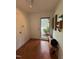 Bright foyer with hardwood floors, bench, and coat closet offers a welcoming entrance at 1708 Quail Ridge Rd, Raleigh, NC 27609