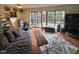 Comfortable living room featuring a large sofa, and windows with backyard views at 1708 Quail Ridge Rd, Raleigh, NC 27609