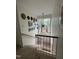 Carpeted staircase with wooden handrails and a large window offering natural light at 1708 Quail Ridge Rd, Raleigh, NC 27609