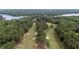 A sprawling golf course meanders through a dense forest, showcasing the area's natural beauty and recreational opportunities at 174 Woodwedge Way, Sanford, NC 27332