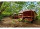 The backyard includes a multi-level deck, perfect for outdoor entertaining in a private, wooded setting at 174 Woodwedge Way, Sanford, NC 27332