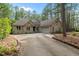 Beautiful brick home with a well-maintained lawn and long driveway at 174 Woodwedge Way, Sanford, NC 27332