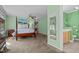 Spacious primary bedroom with a four poster bed, dresser, and en suite bathroom at 174 Woodwedge Way, Sanford, NC 27332