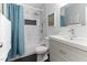This modern bathroom is complete with a shower over tub and a white single sink vanity at 194 Catskill Ct, Burlington, NC 27217