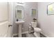 Elegant powder room with pedestal sink, modern fixtures, and neutral decor at 194 Catskill Ct, Burlington, NC 27217