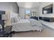 Modern bedroom with a large bed, mounted TV, and neutral tones provides a calm and inviting space at 194 Catskill Ct, Burlington, NC 27217
