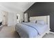 Comfortable main bedroom with large bed and cool blue bedding with walk through to bath at 194 Catskill Ct, Burlington, NC 27217