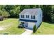 Well-maintained two-story home with gray siding, black shutters, and lush green lawn at 194 Catskill Ct, Burlington, NC 27217