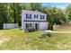 Inviting two-story home featuring a one car garage, lush landscaping, and well-maintained front lawn at 194 Catskill Ct, Burlington, NC 27217