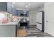 Updated kitchen with stainless steel appliances, gray cabinets, and modern countertops at 194 Catskill Ct, Burlington, NC 27217