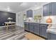 Bright kitchen area with stainless steel appliances, gray cabinets, and stylish backsplash at 194 Catskill Ct, Burlington, NC 27217