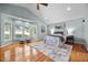 Spacious bedroom with hardwood floors and a large window overlooking the yard at 1973 Elon Ossipee Rd, Elon, NC 27244
