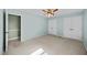 Bedroom featuring light blue walls, two closets, and carpet flooring at 1973 Elon Ossipee Rd, Elon, NC 27244