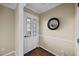 Bright foyer with a decorative glass front door, wood floor, and neutral colored walls at 1973 Elon Ossipee Rd, Elon, NC 27244