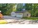 Detached garage with two bays and a long concrete driveway at 1973 Elon Ossipee Rd, Elon, NC 27244