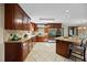 Kitchen features stainless steel appliances, granite counters and custom wood cabinets at 1973 Elon Ossipee Rd, Elon, NC 27244