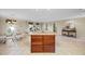Open-concept kitchen featuring a large island with seating and a seamless flow to the dining area at 1973 Elon Ossipee Rd, Elon, NC 27244