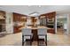 Gourmet kitchen with stainless steel appliances, a granite island, and custom cabinets at 1973 Elon Ossipee Rd, Elon, NC 27244
