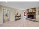 Living room featuring a brick fireplace and a decorative table with a highland cow picture at 1973 Elon Ossipee Rd, Elon, NC 27244