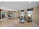 Bright living room with a view to the dining room and decorative furniture arrangements at 1973 Elon Ossipee Rd, Elon, NC 27244