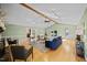 Bright living room featuring hardwood floors, vaulted ceiling, and views of the outdoor area at 1973 Elon Ossipee Rd, Elon, NC 27244