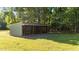 Outbuilding with gravel floor and grass lawn at 1973 Elon Ossipee Rd, Elon, NC 27244