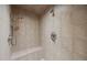 Modern tiled shower with a built-in bench and dual shower heads at 1973 Elon Ossipee Rd, Elon, NC 27244