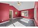 Sunroom with red walls, vaulted ceiling, and two sources of outside light at 1973 Elon Ossipee Rd, Elon, NC 27244