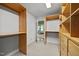 Spacious walk-in closet with custom wood shelving and drawers offering ample storage space at 1973 Elon Ossipee Rd, Elon, NC 27244